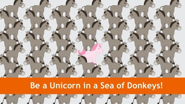 "Be a unicorn in a sea of donkeys!" A pink unicorn among dozens of gray donkeys.